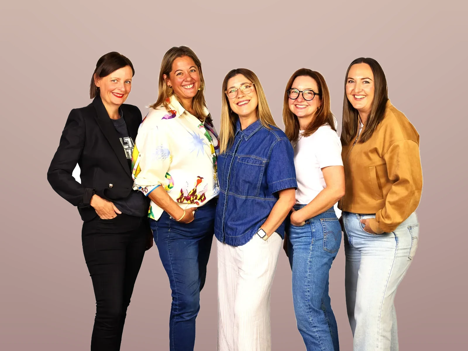 Five members of the HR Gurus team smiling together in a studio portrait